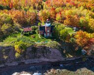 2024-10-16_488870_WTA_Mavic 3 Big Bay Point Lighthouse, located on a rugged bluff overlooking Lake Superior in Michigan’s Upper Peninsula, was constructed in 1896 to address the dangerous...